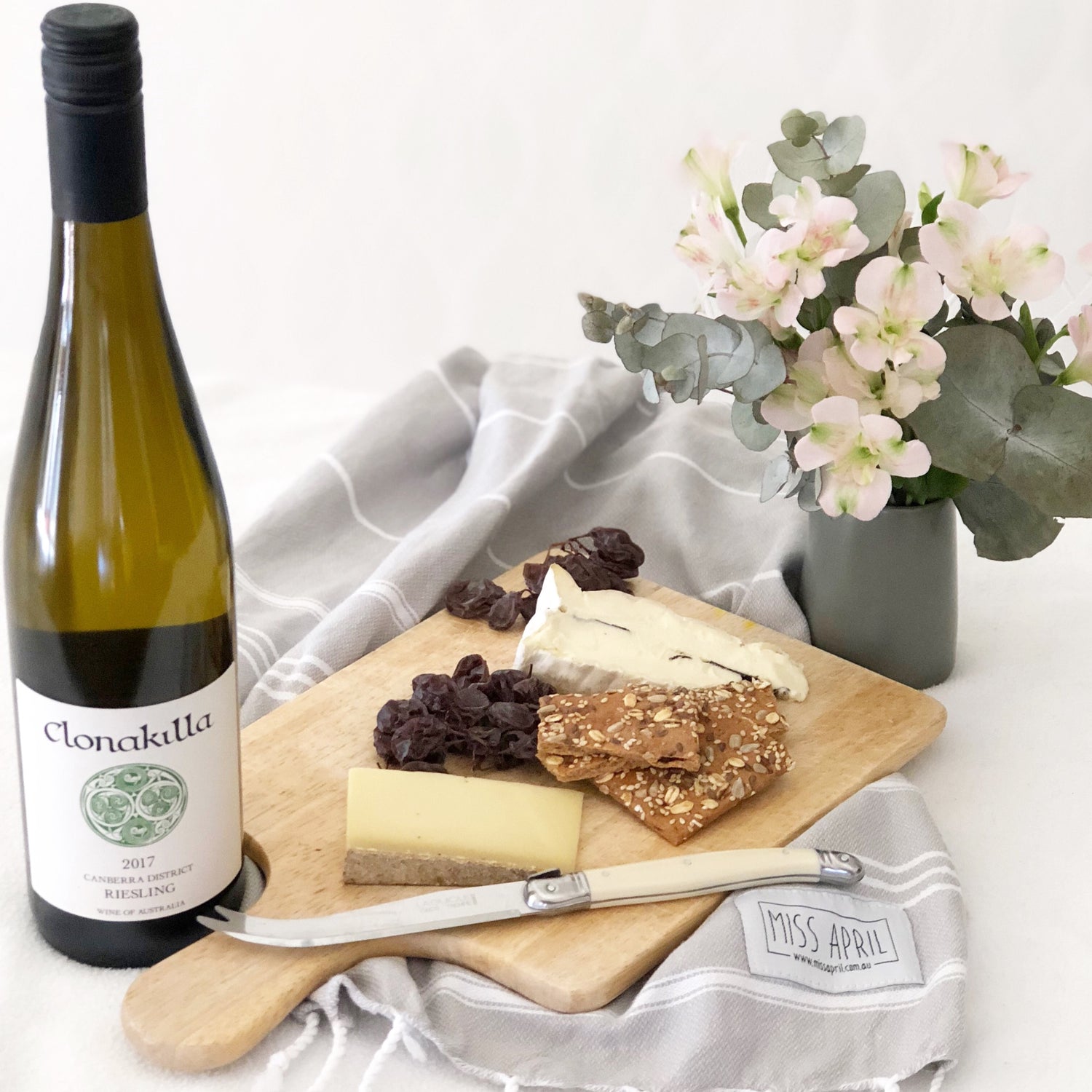 A selection of Canberra region wine and cheese with flowers
