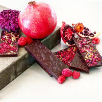 Gourmet dark chocolate bars with berries and pomegranate