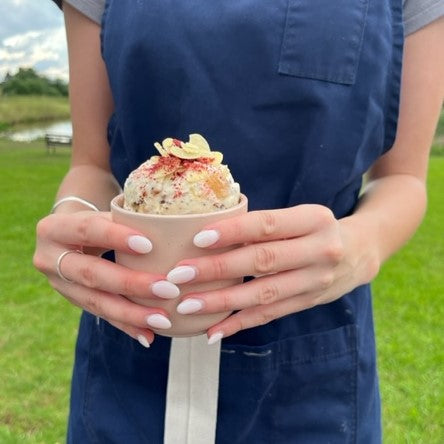 A Sweet Pea & Poppy team member holding a bowl of cassata ice-cream