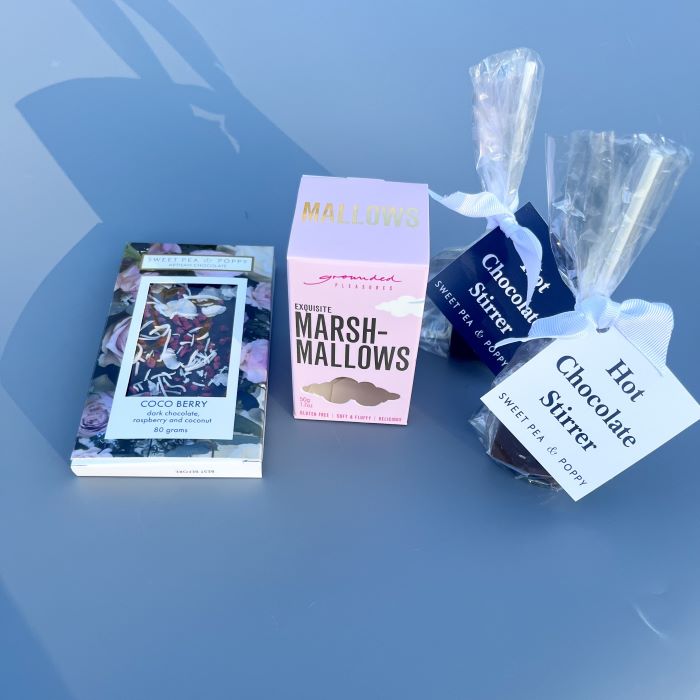 A gift bundle with hot chocolate stirrers, marshmallow and a dark chocolate artisan chocolate bar