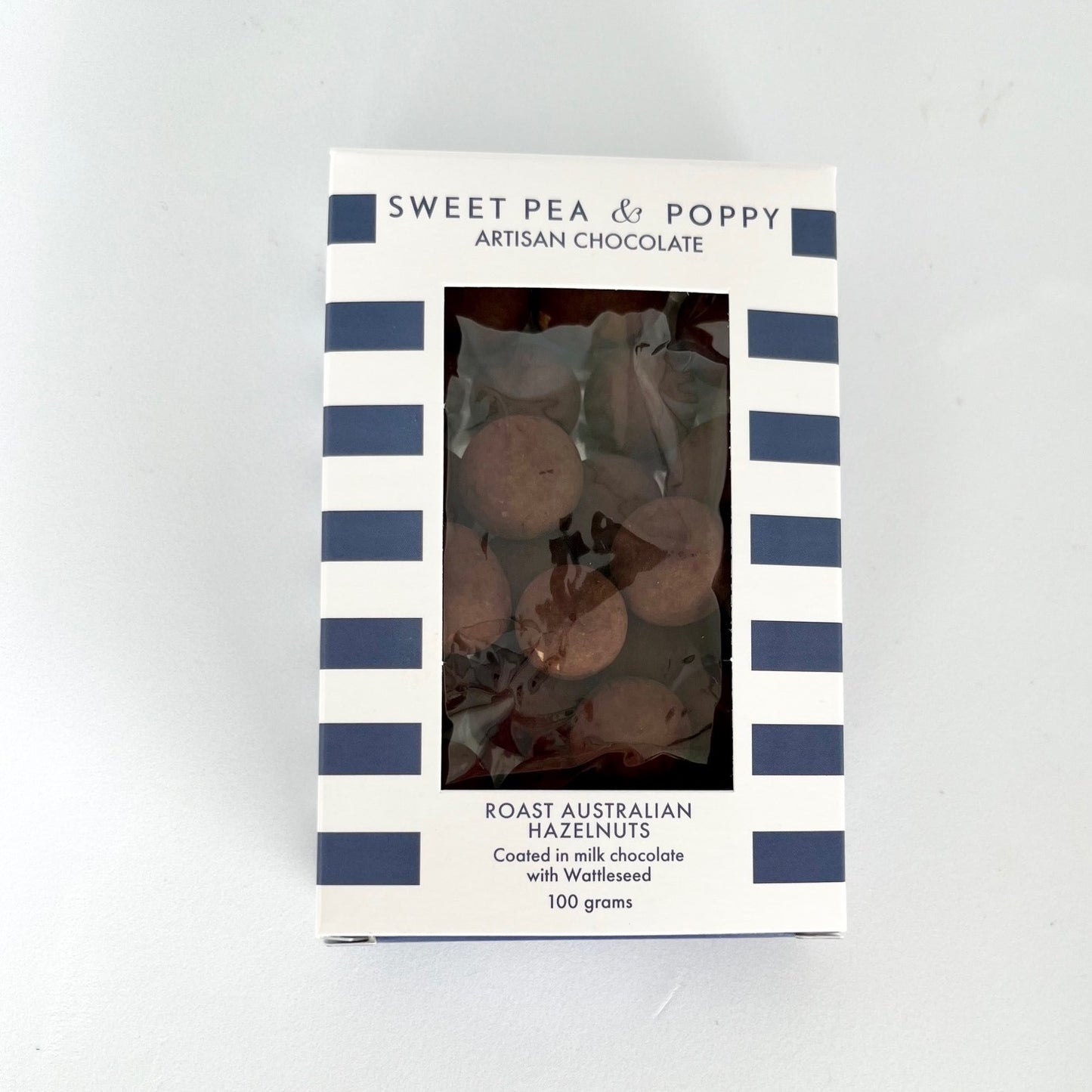 A box of chocolate coated Australian hazelnuts