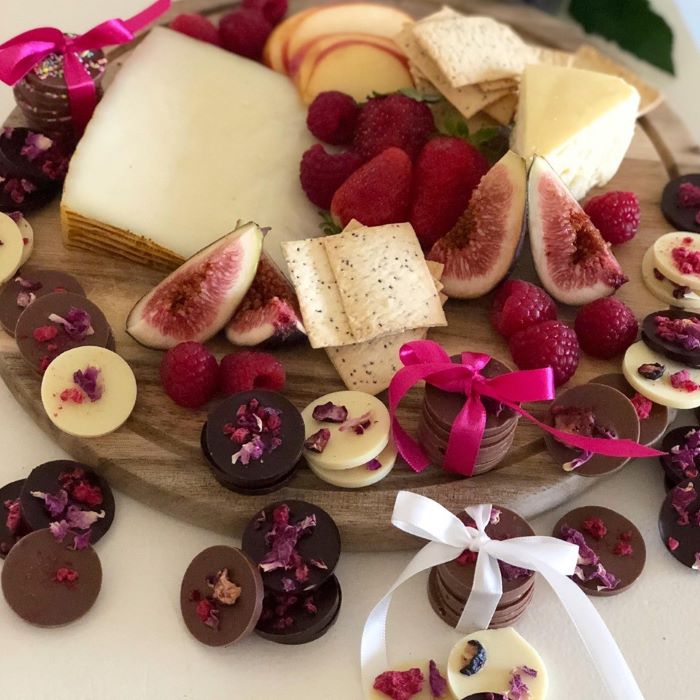 Chocolate mendiants on a grazing board with cheese
