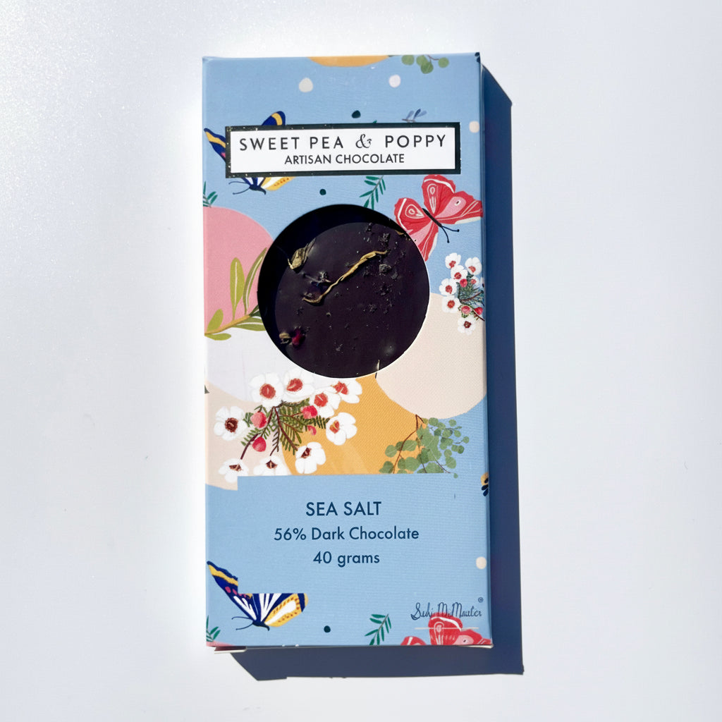 Sweet Pea & Poppy sea salt dark chocolate with Australian illustrated packaging on a light gray background