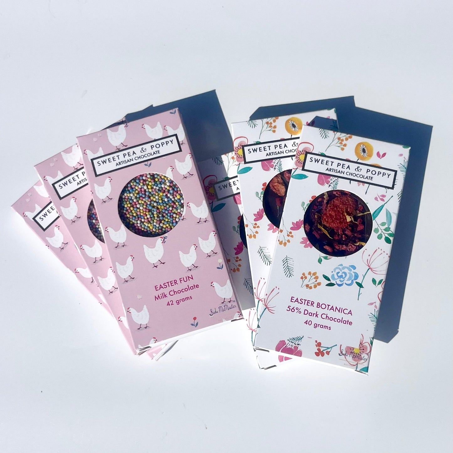 Six Sweet Pea & Poppy chocolate bars with floral and Easter-themed designs on a white background.