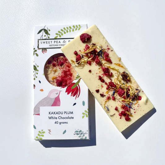 Kakadu Plum white chocolate bar with decorative elements on a white background