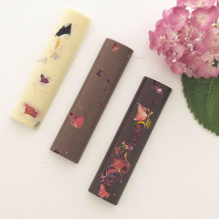 Chocolate snack bars with strawberry and edible petals