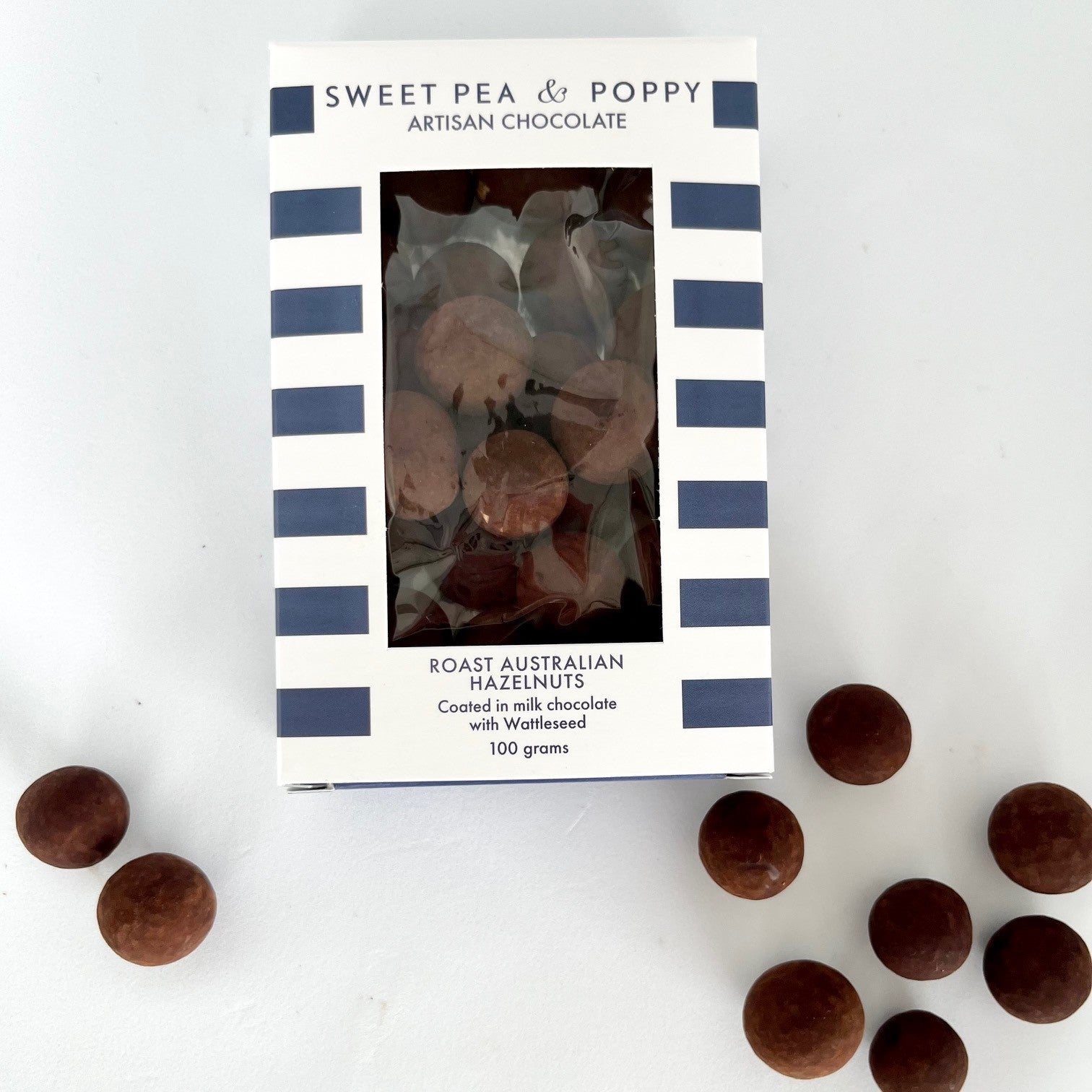 A box of chocolate coated Australian hazelnuts