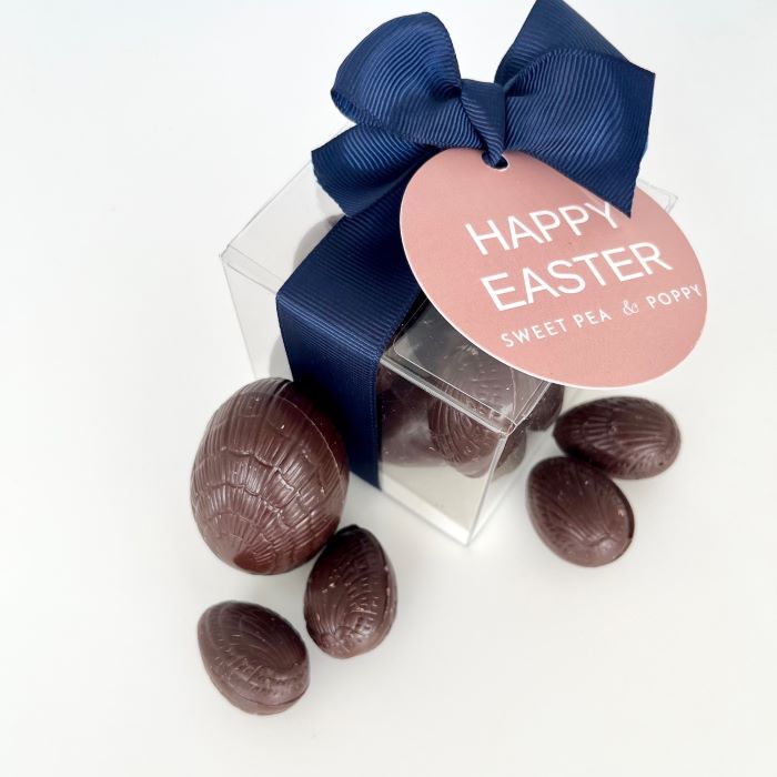 A gift box of dark chocolate Easter eggs with a ribbon bow