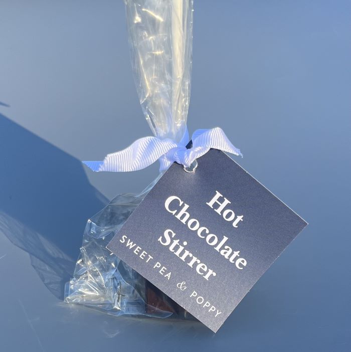 a packaged dark hot chocolate stirrer