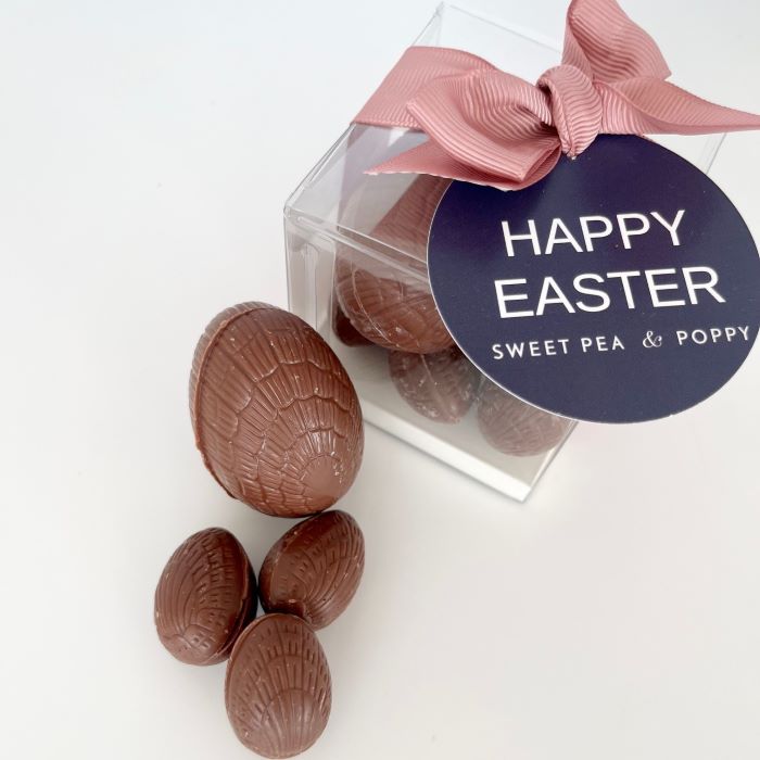 A gift box of milk chocolate Easter eggs with a ribbon bow