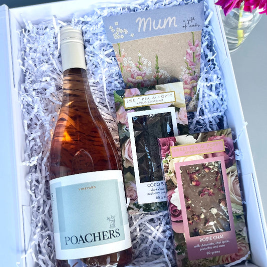 Gift box with a bottle of Poachers wine, chocolates and a gift of seeds card inside