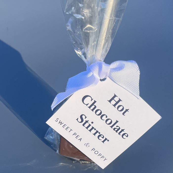 A packaged hot chocolate stirrer