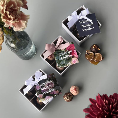 Three gift boxes of artisan chocolate truffles in Espresso Martini, Rose Gin ad Whisky Caramel
